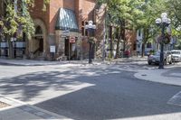 an old brick building with an awning on the outside, with no parking spaces on the sidewalk