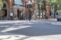 an old brick building with an awning on the outside, with no parking spaces on the sidewalk