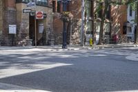 an old brick building with an awning on the outside, with no parking spaces on the sidewalk