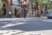 an old brick building with an awning on the outside, with no parking spaces on the sidewalk