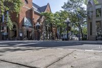 an old brick building with an awning on the outside, with no parking spaces on the sidewalk