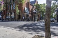 an old brick building with an awning on the outside, with no parking spaces on the sidewalk