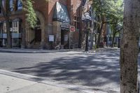 an old brick building with an awning on the outside, with no parking spaces on the sidewalk