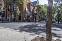 an old brick building with an awning on the outside, with no parking spaces on the sidewalk