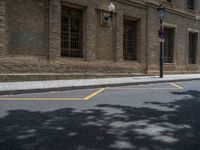 the side walk and walkway of a building is marked with markings for parking spaces below