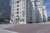 an empty street is lined with buildings and traffic lights in san francisco, california, usa
