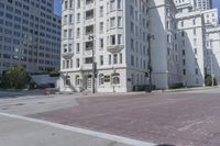 an empty street is lined with buildings and traffic lights in san francisco, california, usa