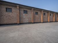 several brick building with windows next to each other on a sunny day in asia in the afternoon