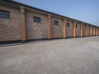 several brick building with windows next to each other on a sunny day in asia in the afternoon