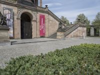 Berlin City Architecture: Classic Mansion on Cobblestone Road with Green Grass and Trees