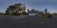 a circular image shows an old house with parking lot on the sidewalk and driveway at sunset