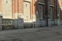 a building with brick walls has no cars parked by it in front of it and no one is visible