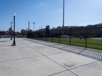 a black metal fence has been placed around this tennis court area at highpoint field