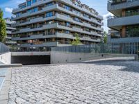 a large brick pavers are arranged into a building courtyard and in a city plaza