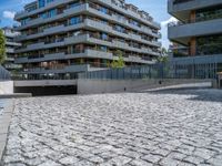 a large brick pavers are arranged into a building courtyard and in a city plaza