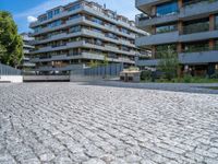 a large brick pavers are arranged into a building courtyard and in a city plaza