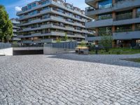 a large brick pavers are arranged into a building courtyard and in a city plaza