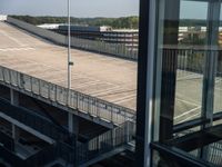 an outside parking lot is set off from the air plane area at an airport for boarding passengers