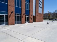 the concrete is covered with a large brick building and a blue and white sign reads e & b on it