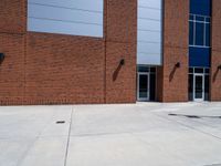 the concrete is covered with a large brick building and a blue and white sign reads e & b on it