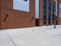 the concrete is covered with a large brick building and a blue and white sign reads e & b on it