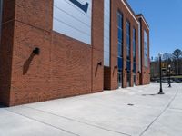 the concrete is covered with a large brick building and a blue and white sign reads e & b on it