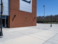 the concrete is covered with a large brick building and a blue and white sign reads e & b on it