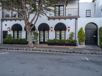 a picture of a building that has an entrance and trees in the front of it