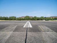 Clear Sky and City Life: View of Berlin Airport on the Horizon