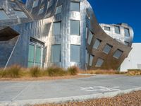 modern architecture with a unique sculpture in the background, in front of a white wall