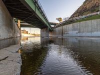 Clear sky over Los Angeles River bridge at dawn