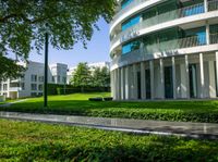 the large courtyard in front of a building and trees are surrounding it that is mostly empty