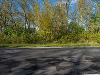 a fire hydrant sits in the middle of an empty road and stands out for miles