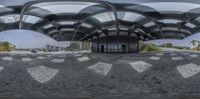 an artistic image of the entrance to a building in a city that has circular windows