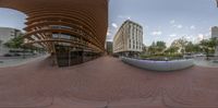 the view of some buildings from a fish - eye lens lens shows the outside area