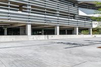 empty parking garage with large open spaces on one side and a parking spot next to it