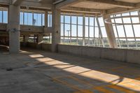 a yellow crosswalk in a building with large windows and light coming through it that says