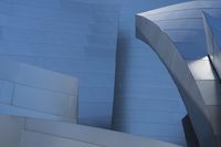 a close up of a white building with many different angles of architecture around it at an angle to the sky