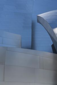 a close up of a white building with many different angles of architecture around it at an angle to the sky