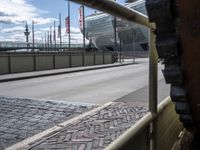 there is a very large view through the rail of this building while traffic goes past it