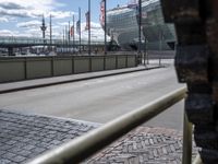 there is a very large view through the rail of this building while traffic goes past it