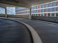 a car is driving on the highway through an underground parking garage area in a city