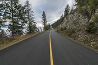 the road is empty and it looks good to be a mountain trail climber is riding