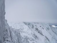 Cloudy Landscape: Gloomy Mountains Covered in Snow
