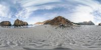 the fisheye view of rocky hills and clouds over the beach is as a good example for a 360 - lens