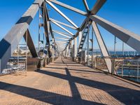 metal beams are painted blue and white on the bridge crossing the ocean in sydney, australia