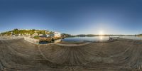 this is an image of a 360 - lens fisheye with a beach scene in the background