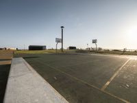 Coastal Dawn in Portugal: A Basketball Court by the Ocean