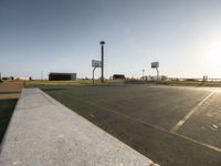 Coastal Dawn in Portugal: A Basketball Court by the Ocean