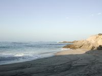 Coastal Day at the Beach: Clear Sky and Open Space